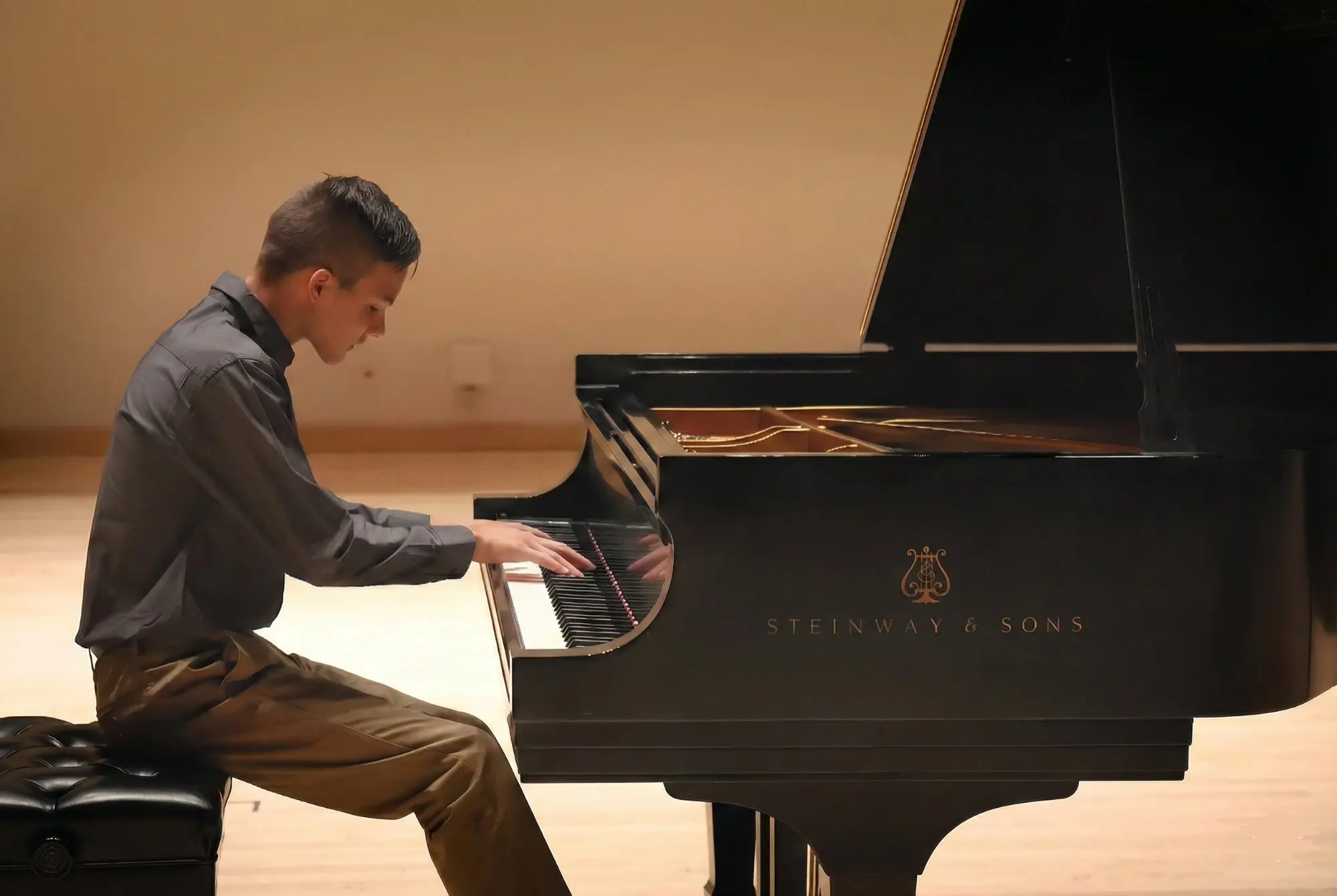 East Cobb piano student performing Rachmaninoff on a Steinway at recital