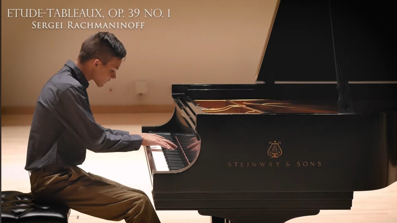 Student performing classical piano piece at annual recital