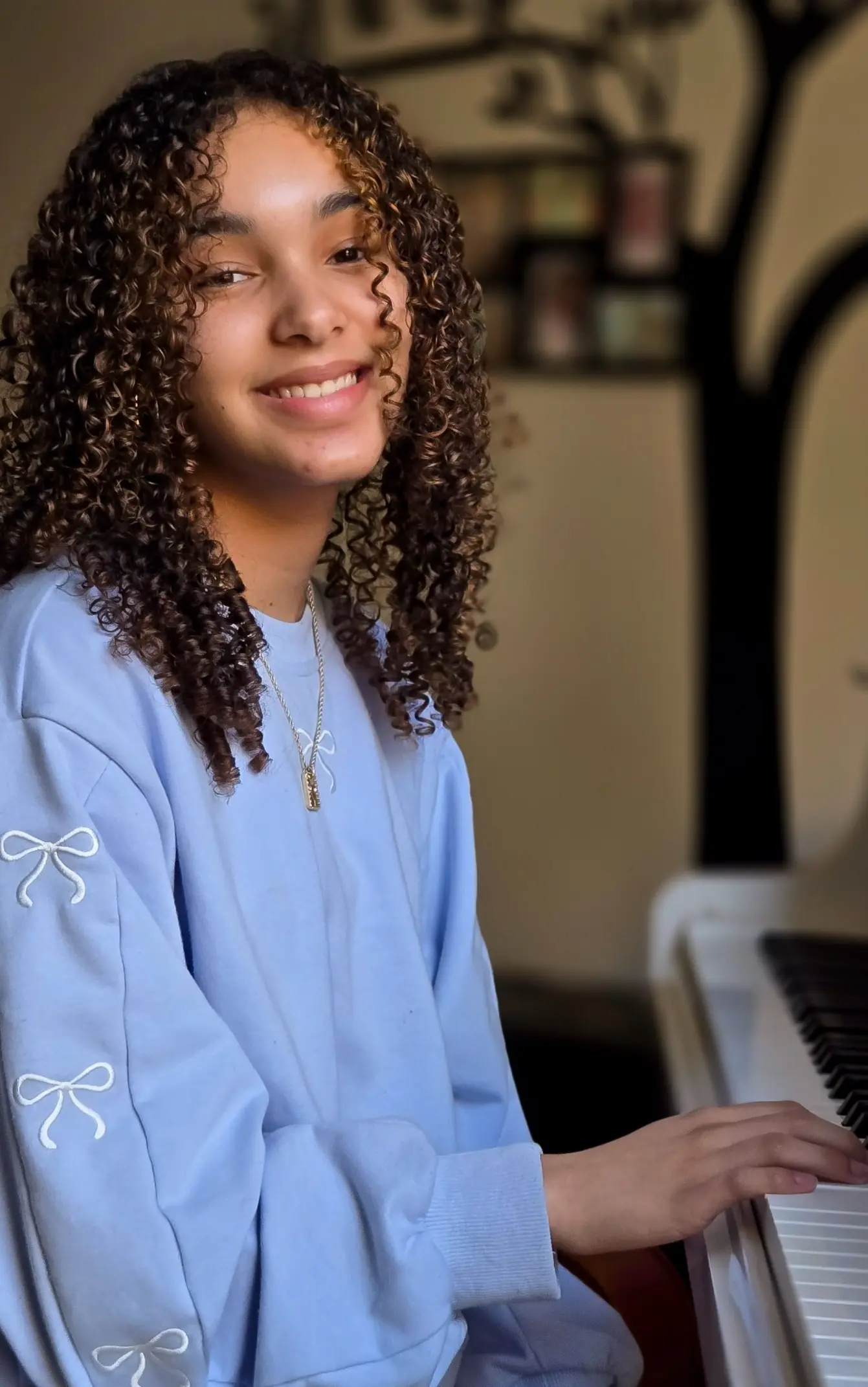 Piano student smiling during an in-home lesson in East Cobb