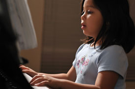 Student taking piano lessons in Marietta, Georgia